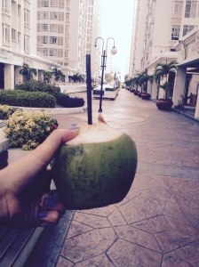 Enjoying a coconut in Ho Chi Minh City